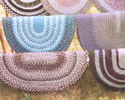 a variety of basic oval Karakul wool rugs
